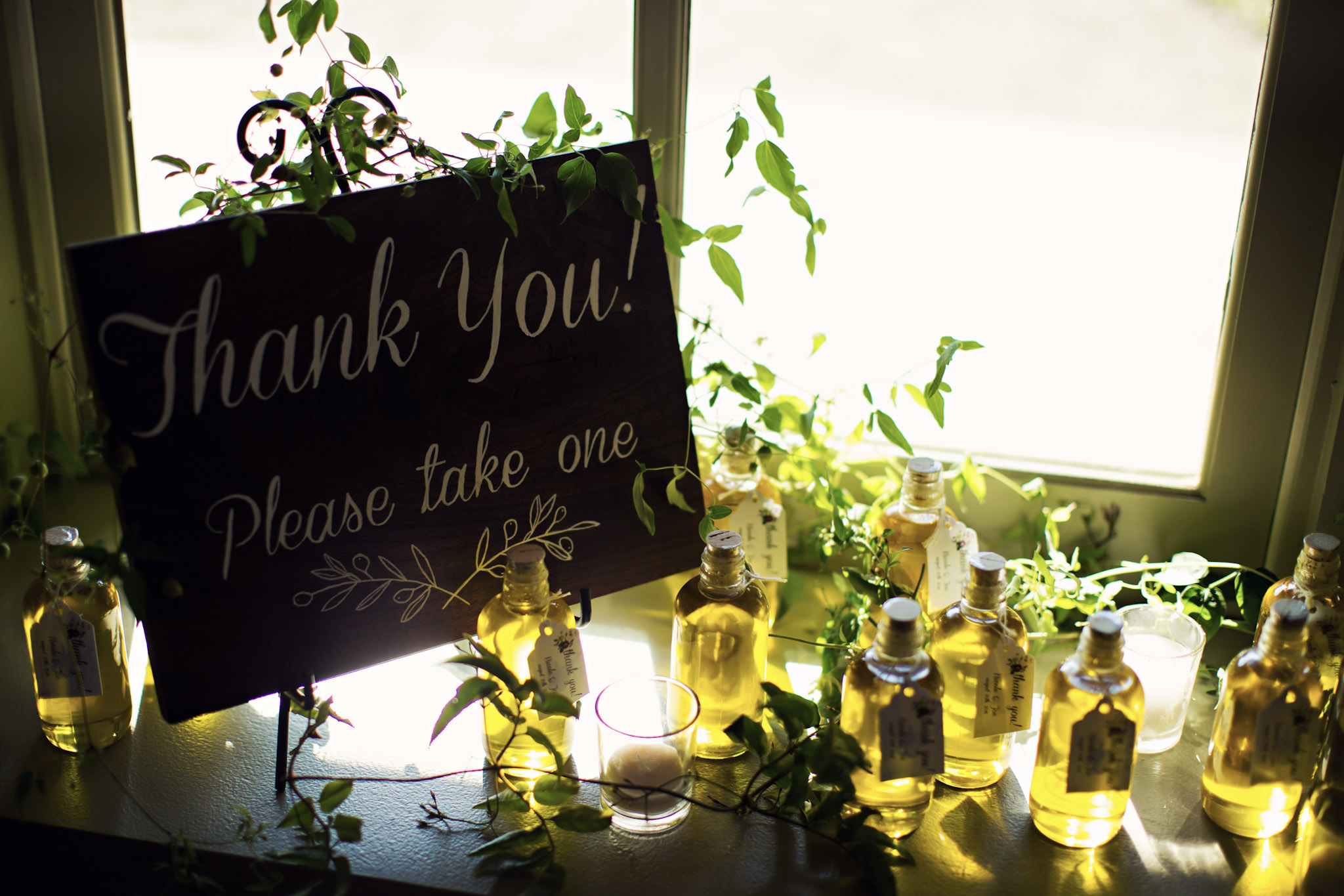 Photo by Elizabeth Fox of scented oil bottles for wedding guests