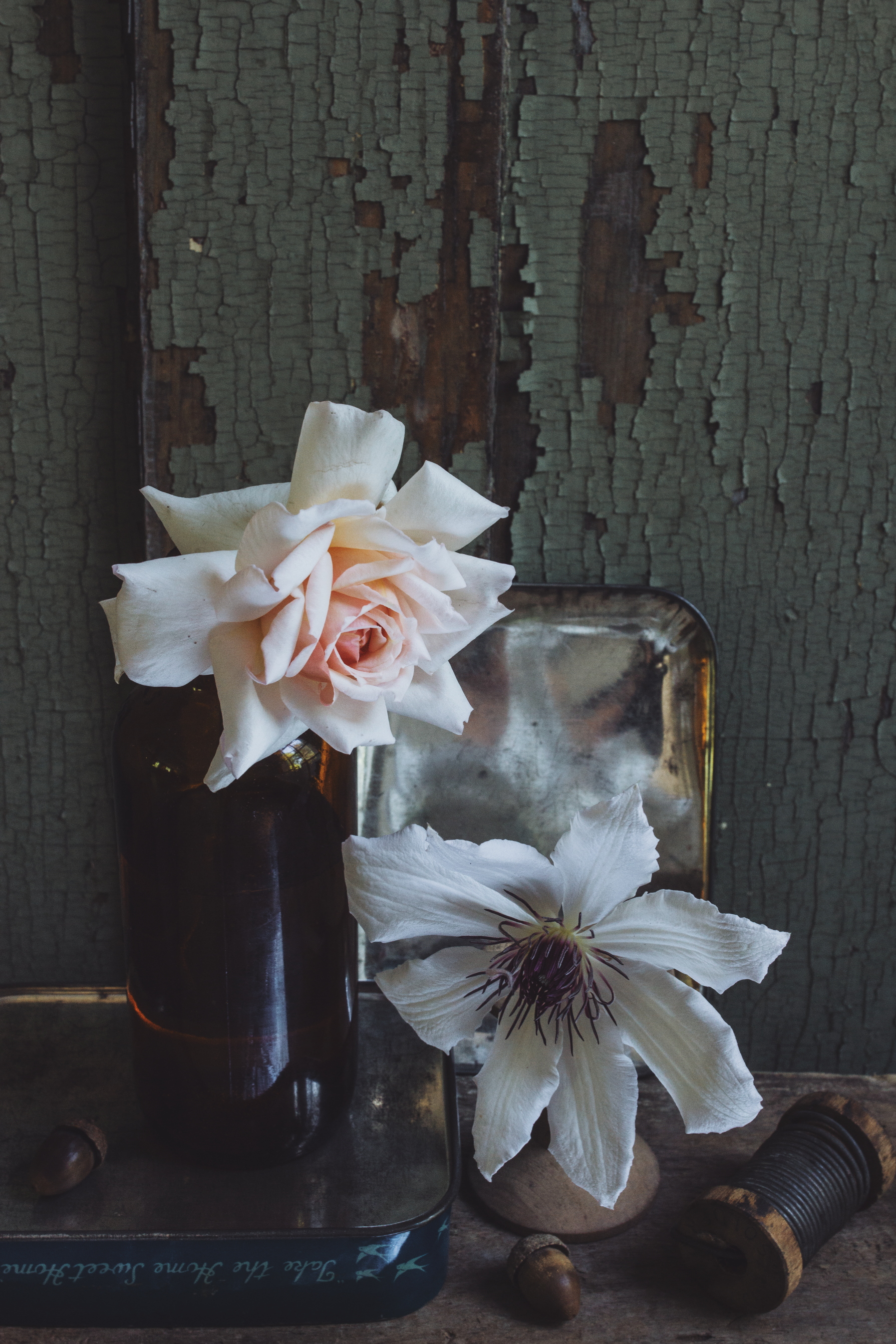 simple stem flower arrangements in vintage bottles 