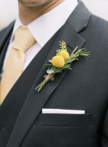 Photo by Basia of DIY wedding boutonniere on lapel