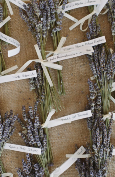 Photo by Basia of DIY lavender bunch name cards for wedding 