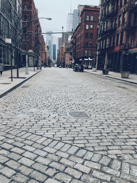photo of brick paved street in soho new york