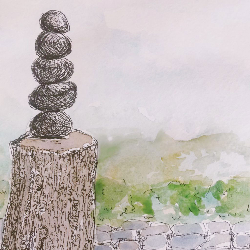 sketch of tree stump and stacked rocks 