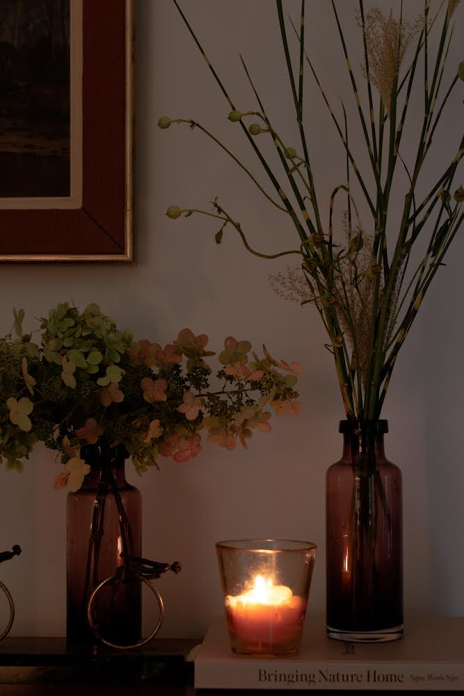 a simple yet elegant fall flower arrangement using antique bottles