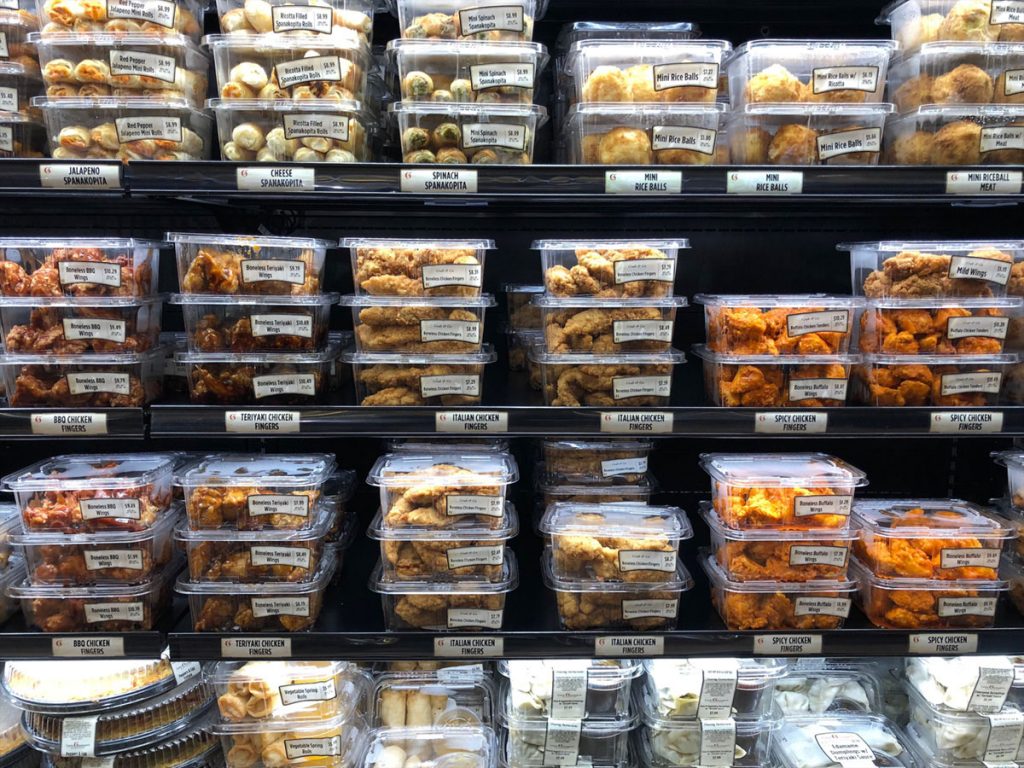 refrigerated display in a grocery store of ready to eat manufactured food 